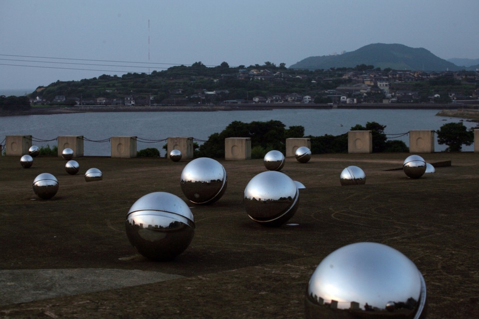 A memorial to victims of mercury poisoning overlooking Minamata Bay.